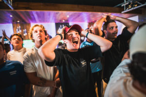 Fans watching sport live at Belushi's sports bar atmosphere.